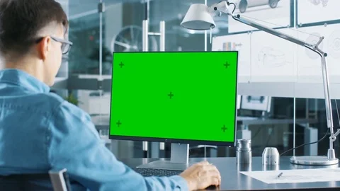 Automotive Engineer Working on a Computer With Isolated Mock-up Green Screen. Stock Footage