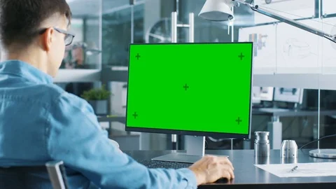 Automotive Engineer Working on a Computer With Isolated Mock-up Green Screen. Stock Footage 83796577