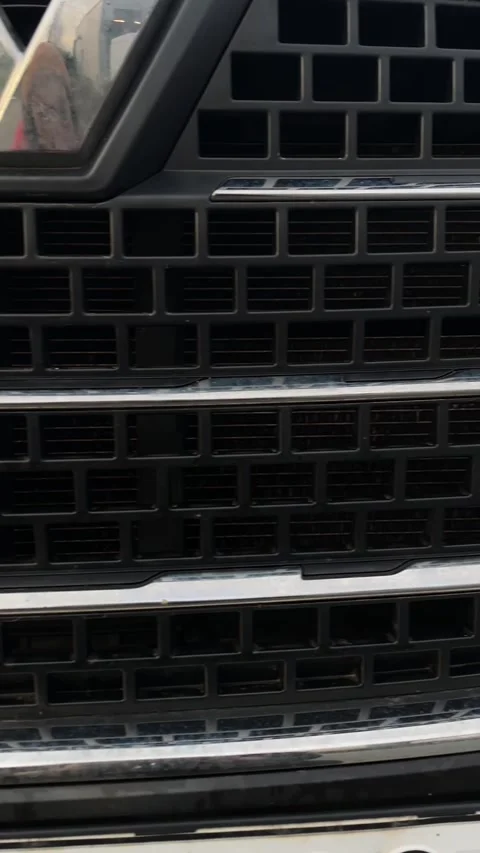 Automotive front facade featuring geometric patterns and reflective surfaces Stock Footage 335366056