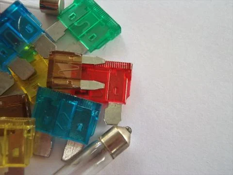 Automotive multi coloured different sized plastic blade plug spade car fuses Stock Photos