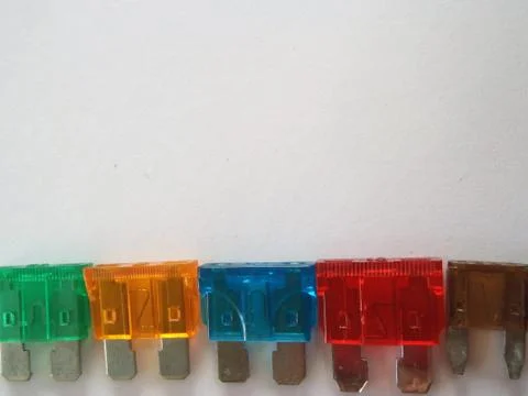 Automotive multi coloured different sized plastic blade plug spade car fuses Stock Photos