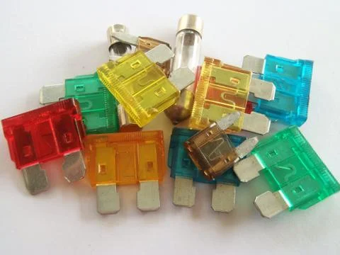 Automotive multi coloured different sized plastic blade plug spade car fuses Stock Photos