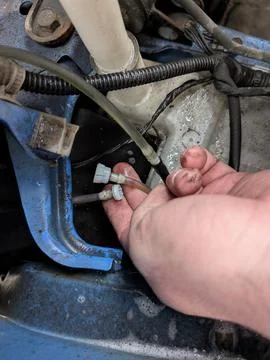 Automotive Technician Connecting Small Engine Fluid Lines Stock Photos