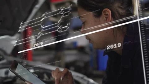 Automotive technician tapping tablet, starting animated timeline over engine Video stock 332428288