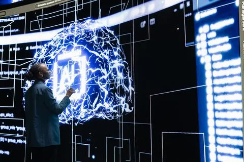 Autonomous AI agent writing complex code under female programmer supervision 스톡 사진