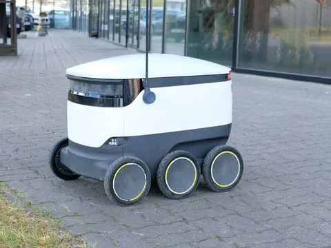 Autonomous delivery robot. Concept of future, technology, unmanned courier robot Stock Photos