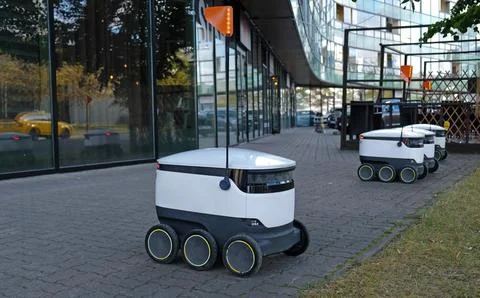 Autonomous delivery robot. Concept of future, technology, unmanned courier robot Stock Photos