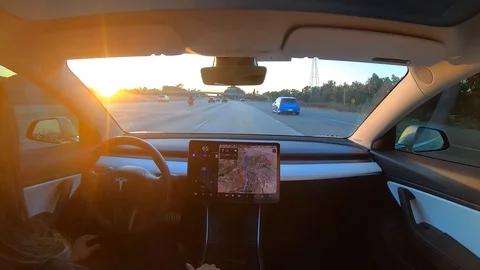 Autonomous driverless car using self driving autopilot feature Stock Footage 118803240