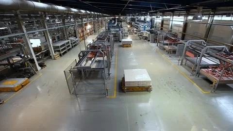 Autonomous guided vehicles and Autonomous Mobile Platform transport products in Stock Footage 321053470