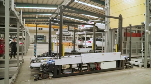 Autonomous mobile robot operating inside a smart parking facility in China Stock Footage 328294914
