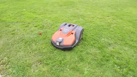 Autonomous robot lawn mower at work Stock Footage 163101432