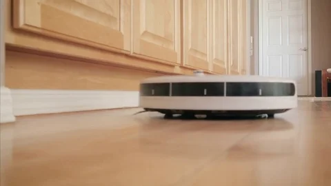 Autonomous Robot Vacuuming Hardwood Floor Stock Footage 80408573