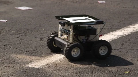 Autonomous robotic car moving in the road Stock Footage 93534183