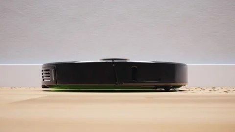 Autonomous robotic vacuum cleaner cleaning floor. Smart home. Loopable animation Stock-Footage 201175177