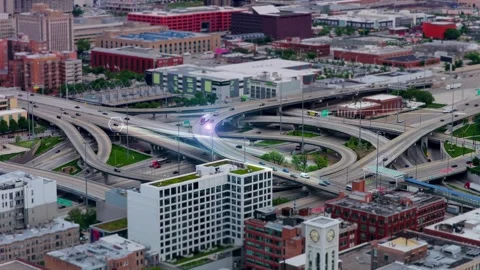 Autonomous self driving cars navigating Chicago highway interchange with digital Stock Footage 345492707