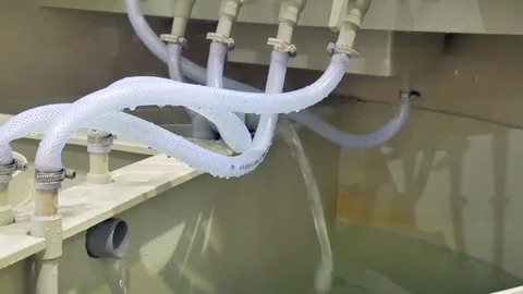 Autonomous sewage system - water pump and lot of valves Stockbeeldmateriaal 105570273