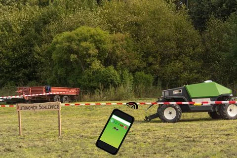 Autonomous tractor in the field. Stock Photos