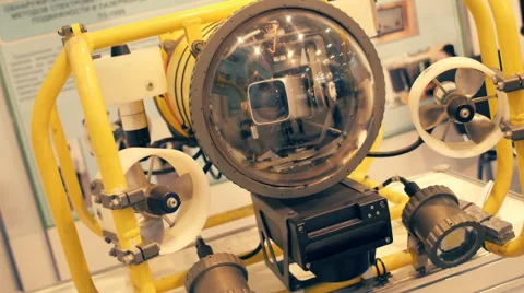 Autonomous underwater robot explorer of yellow color with a video camera Stock Footage 68371048