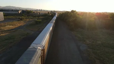 Autorack train charging into the Sunset 2020 Stock Footage 196139984