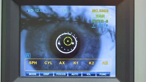 An autorefractometer testing each human eye in turn. Stock Footage 84652957