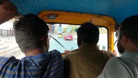 Autorickshaw-passengers-in-drivers-seat Stock Footage 125620882