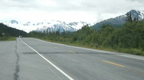 Autos passing view Alaska mountains P HD 8470 Stock Footage 811122