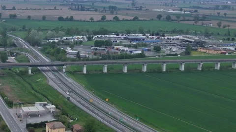 Autostrada A1 and A21 interchange with Via Emilia near Fiorenzuola d’Arda Stock Footage 334084438