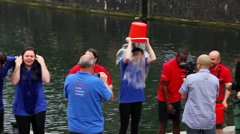 Autotrader magazine staff take the Ice Bucket challenge in fundraising Stock Footage