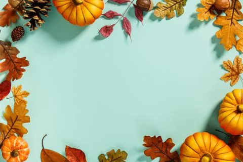 Autumn background creative layout with decorative small pumpkins and autumn.. Stock Photos