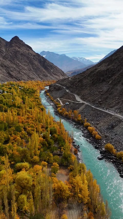 Autumn bliss in Kargil – vertical drone footage over winding river. Stock Footage 310664579