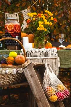 Autumn brunch table in the backyard with pumpkin and yellow decor. Stock Photos