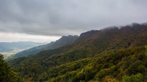Autumn clouds and forest in Coll De Bracons, La Garrotxa, Girona, Spain Stock Footage 136737514