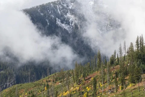 Autumn clouds dancing on the side of Teewinot Mt. timelapse Grand Tetons NP 8k Stock Footage 123114082
