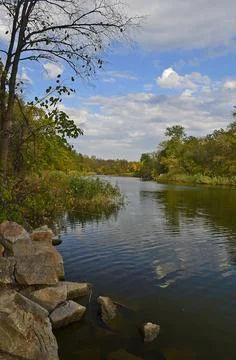 Autumn cold river in the forest Stock Photos
