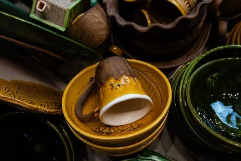 Autumn colored handmade dishware background Stock Photos