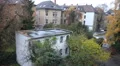 Autumn colors at rainy day backstreet idyll with nature in a city HD Footage