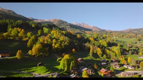 Autumn colors transform a quiet mountain village landscape Stock Footage 320266226