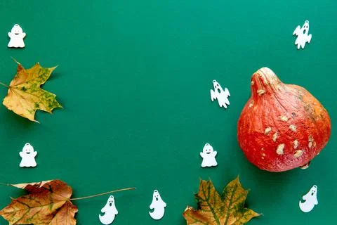 Autumn composition. Frame made of Pumpkins,dried leaves and decorative ghoast Stock Photos