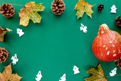 Autumn composition. Frame made of Pumpkins,dried leaves and decorative ghoast Stock Photos