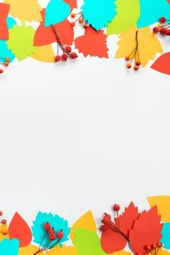 Autumn composition frame Paper colored leaves branches berries on white backg Stock Photos