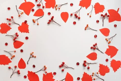 Autumn composition frame Paper colored leaves branches berries on white backg Stock Photos