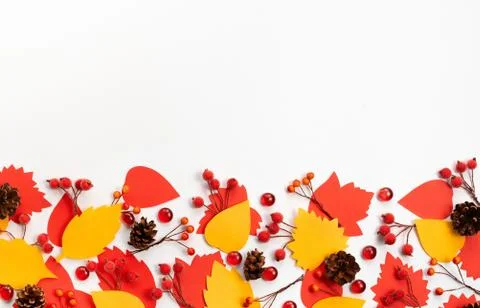 Autumn composition frame Paper colored leaves branches berries on white backg Stock Photos