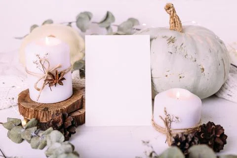 Autumn composition mockup, cocoa, marshmallows, cookies, pumpkin and candles. Fotos Stock