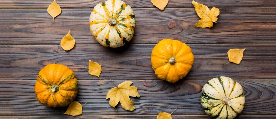 Autumn composition. Pattern made of dried leaves and other design accessories Stock Photos
