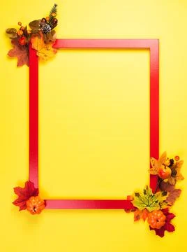 Autumn composition with red frame and fall leaves Stock Photos