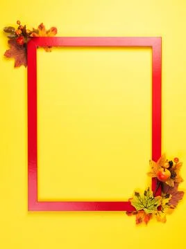 Autumn composition with red frame and fall leaves Stock Photos