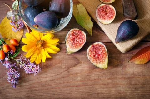 Autumn composition - ripe figs and flowers. fruits and vegetables Stock Photos