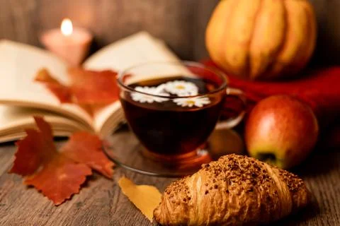 Autumn composition, tea, pumpkins, candle on the table. Autumn comfort at hom Foto stock