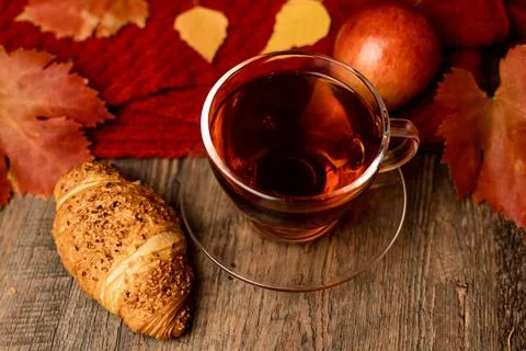 Autumn composition, tea, pumpkins, candle on the table. Autumn comfort at hom Stock-Fotos