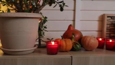 Autumn decoration of the kitchen interior pumpkins and candles Stock Footage 286097334